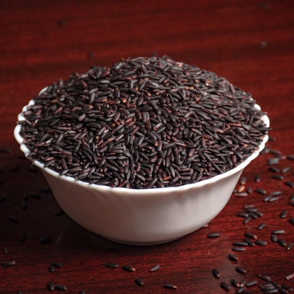 Manipur's Chak-Hao black rice displayed at a community feast, the GI-tagged variety behind India's only black rice geographical indication